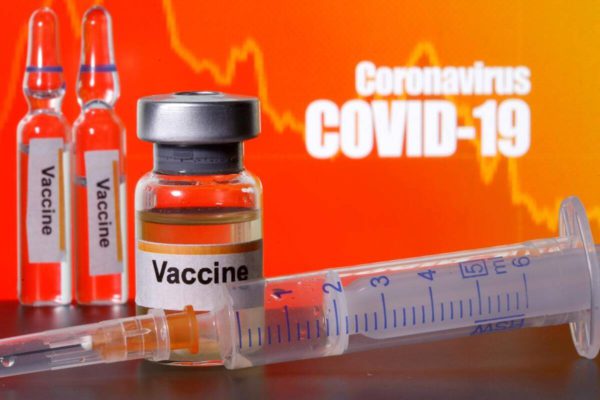 COVID-19 vaccine vials and syringe against an orange background with COVID-19 text.