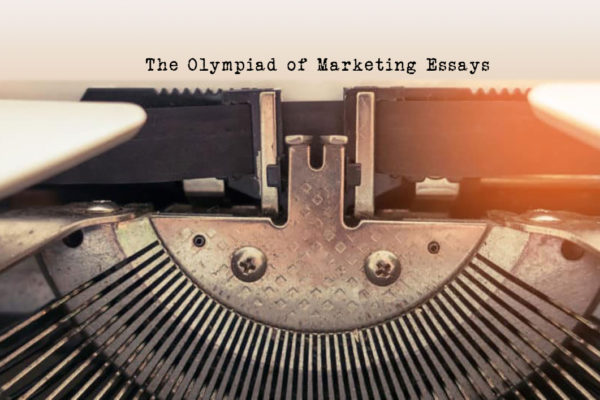 Close-up of an old typewriter with sunlight shining through, labeled "The Olympiad of Marketing Essays.